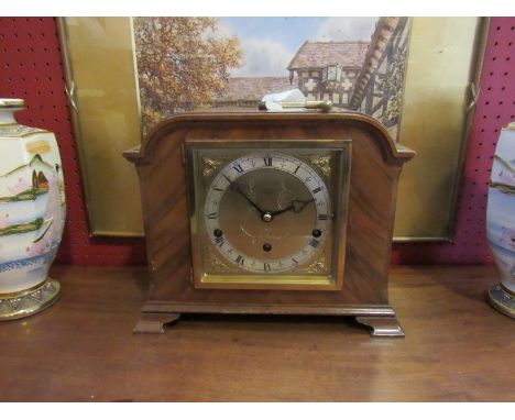 A walnut cased mantel clock with Elliott striking and chiming movement with platform escapement 
