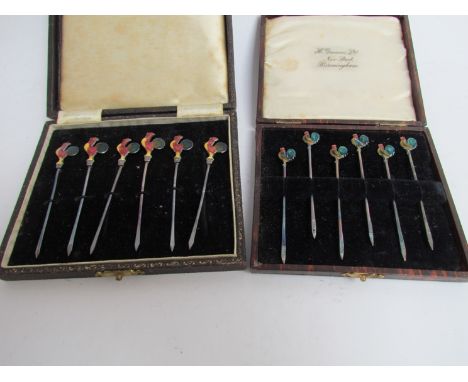 A cased set of six Adie Brothers limited silver cocktail sticks with enamel cockeral terminals, Birmingham 1936 and associate