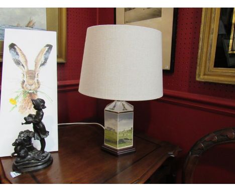 A ceramic table lamp with golfing motifs, cream linen shade, 45cm tall 