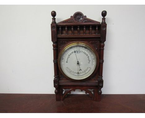 A late Victorian silvered face barometer with carved case 55cm x 29cm