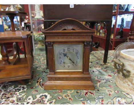 A late Victorian oak cased bracket clock with architectural design, silvered Arabic dial, 8 day striking movement, 41cm tall 