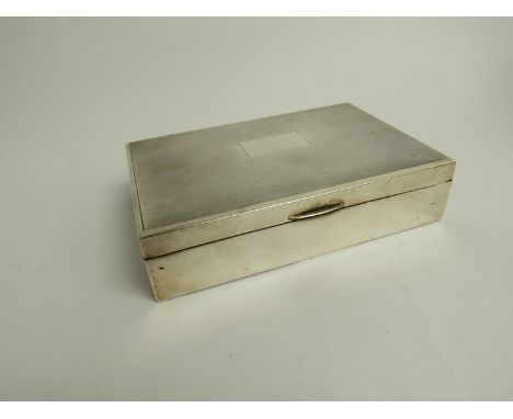 A silver engine turned twin compartment cigarette box with wood lined interior (few dents), 4cm x 19cm x 11cm