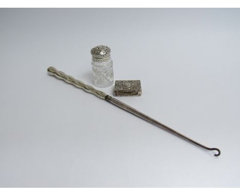 A Victorian silver long button hook (seam on handle split), silver topped crystal scent bottle and silver match box case all 