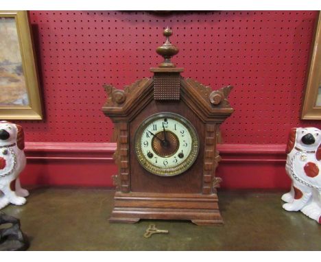 An early 20th Century American mantel clock, Ansonia 8 day movement with finial surmounted, 44cm tall