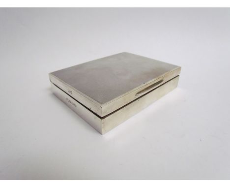 A silver playing cardcase with engine turned detail to top Birmingham 1961, wood interior 2.5cm x 11.5cm x 8.5cm