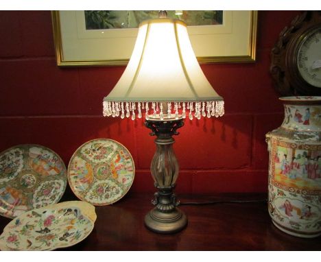 An ornate table lamp with silk shade and beaded fringe, 66cm tall