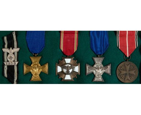Five German World War II awards, including two Police crosses and a bar to an Iron Cross, 2nd class See illustration  Conditi