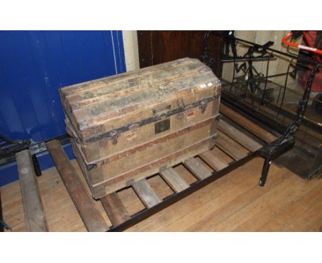 A Victorian dome top trunk, 86 cm wide, and a cast iron day bed (2)