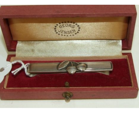 A Georg Jensen sterling silver clip, Cherry Heering, boxed, a silver cruet set, cased, and other items, approx. 3.3 ozt (weig