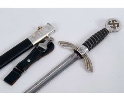 A German World War II Luftwaffe 1st pattern sword, the blade marked SF Solingen, with a scabbard and hanging clip  See illust