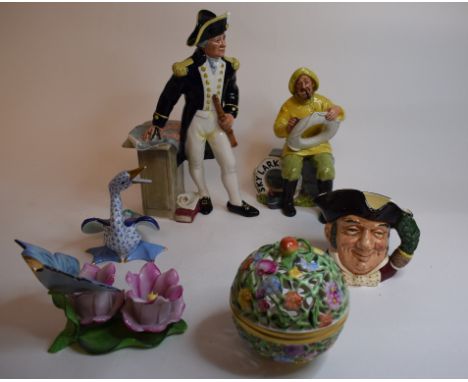 A Royal Doulton figure, The Captain HN2260, another, The Boatman HN2417, a Royal Worcester figure, The Dandelion, 3084, a Her