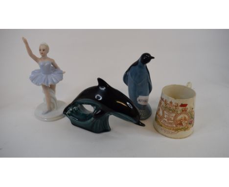 A Poole pottery dolphin, 28 cm long, four other Poole figures, a brass carriage clock, assorted Coalport collectors' plates, 