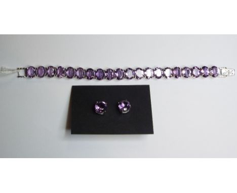 A pair of silver and amethyst earrings, and a similar bracelet