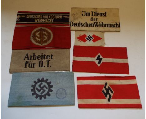 Seven German armbands, including a Sports Award, German Army Worker, Volkssturm, and a Hilter Youth shirt badge (8) Condition