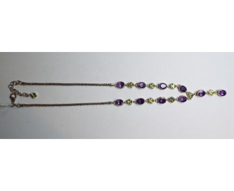 A silver, amethyst and peridot necklace