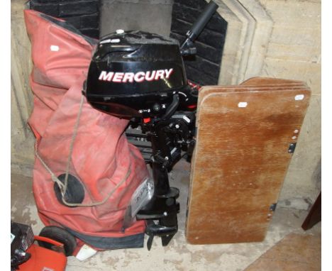 A Mercury 3.5 hp outboard engine, and an inflatable tender (2) Condition report The pull cord does turn the engine.