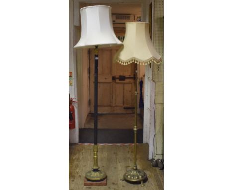 A brass adjustable standard lamp, and another similar (2)