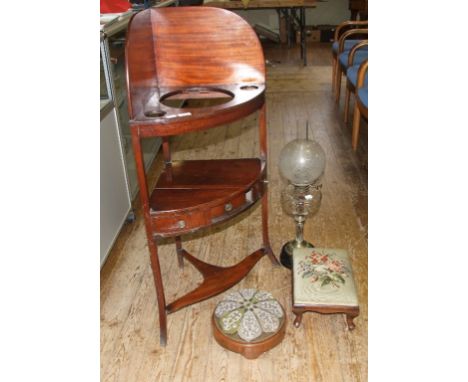 A mahogany corner washstand, 58 cm wide, a beadwork footstool, 26.5 cm diameter, a similar footstool and an oil lamp (4)