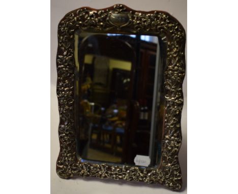 An Art Nouveau silver mirror, with stylised floral and foliate decoration, London 1903, 35 x 25 cm, a gentleman's gold colour