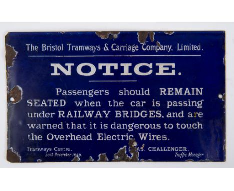 A Bristol Tramways & Carriage Company enamel sign, NOTICE. Passengers should REMAIN SEATED when the car is passing under RAIL