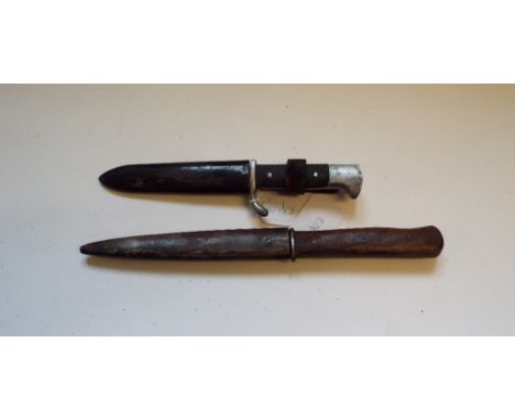 A German dagger, in a metal scabbard with belt loop, 27 cm long, and another similar, 20.5 cm (2) Condition report Please not