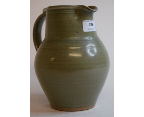 A St. Ives Bernard Leach celadon glaze jug, with impressed factory mark below the handle, 20 cm high