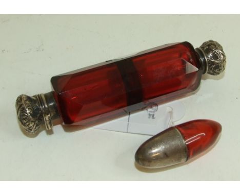 A Victorian silver coloured metal mounted double ended ruby glass scent bottle, 10 cm long, and a silver mounted pill shaped 