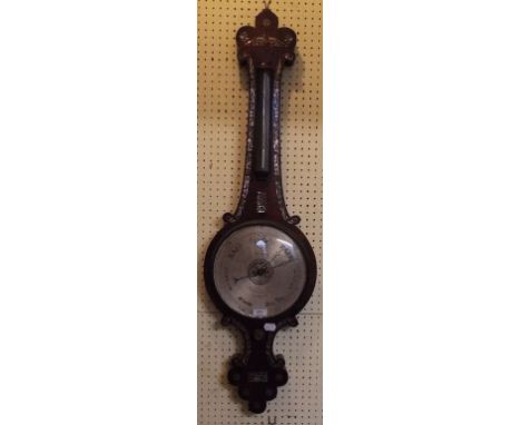 A Victorian wheel barometer, with thermometer, the silvered dial signed Fletcher Late Dwerrihouse and Carter, with a globe to