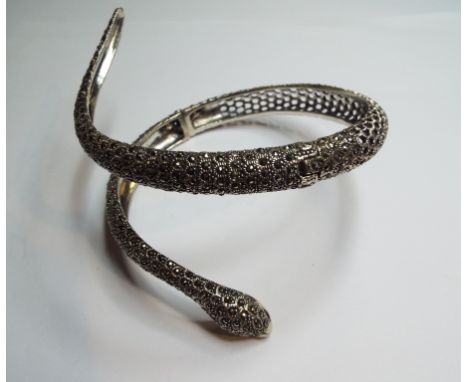 A silver and marcasite slave bangle, in the form of a snake