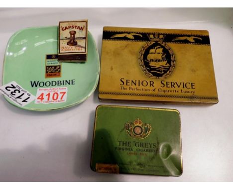 Two cigarette tins, ceramic Woodbine ash tray and a  Capstan match box. UK P&amp;P Group 1 (£16+VAT for the first lot and £2+