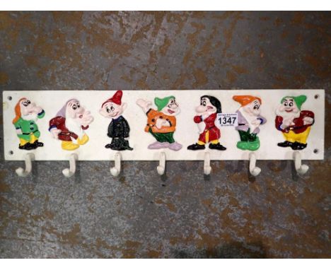 Cast iron seven dwarves cup rack, L: 60cm. UK P&amp;P Group 3 (£30+VAT for the first lot and £8+VAT for subsequent lots) 