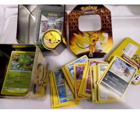 Quantity of Pokémon trading cards in two tins. UK P&amp;P Group 2 (£20+VAT for the first lot and £4+VAT for subsequent lots) 