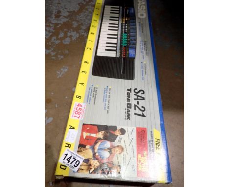 Boxed Casio SA-21 tone bank keyboard. Not available for in-house P&amp;P 