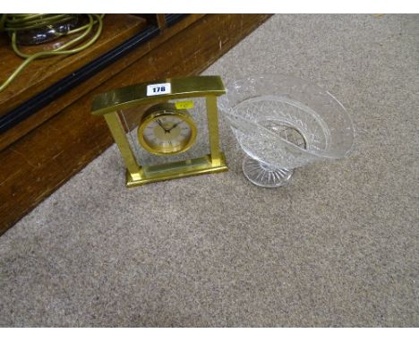 Decorative pedestal glass bowl and an ornamental brass effect mantel clock