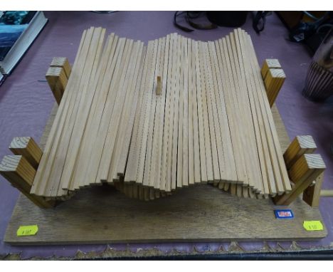 Interesting treen model by Peter Markey of a wind-up small planks depicting the sea and a bobbing boat