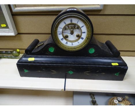 Good size slate mantel clock with scroll detail to the base