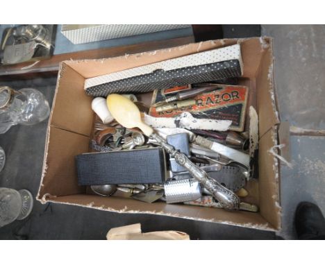 A Box of sundry items, old tin, loose flatware including a silver handled serving spoon , old razor, plated vesta cases, etc.