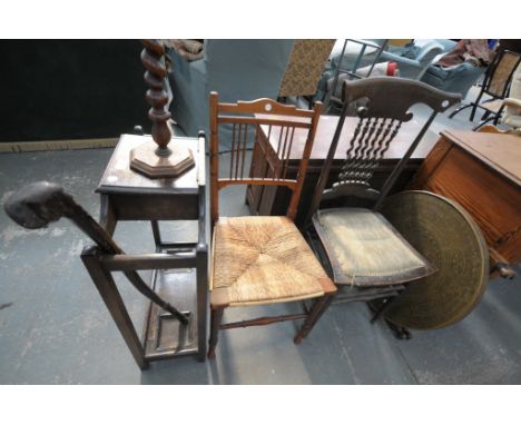 An Oak stick stand and walking stick, barley twist smokers stand, 2 spindle back country chairs and a Burmese brass top table