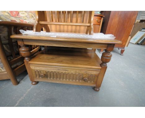 An Ercol elm drop leaf TV stand with a single drawer.