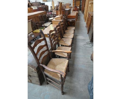 A Harlequin set of six ash ladder back chairs
19th Century including an open arm chair each with graduated shaped arched spla