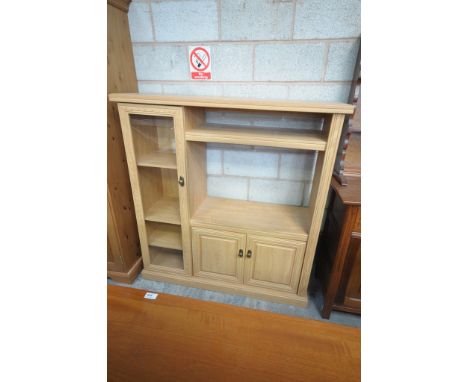 A Modern light oak effect wall cabinet with a single glazed door.