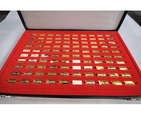 A Cased set of gold plated sterling silver miniature car proof set.