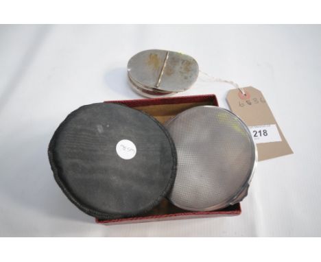 A Silver plated hinged snuff box and a circular silver compact. (2)