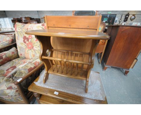 An Ercol oak magazine rack.