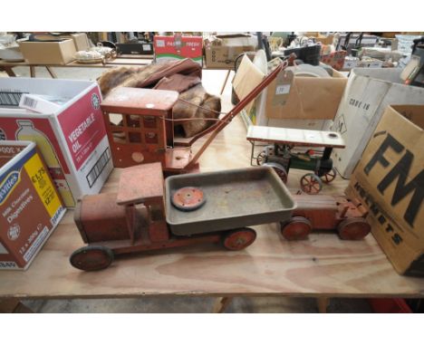A Vintage Tri ang tin plate model crane, a tin plate flat bed truck, a Mamod model steam engine and a vintage tin plate tract