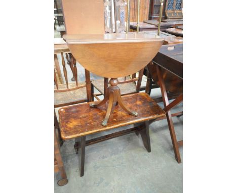 A Reproduction mahogany drop leaf occasional table and a stained rustic bench. (2)