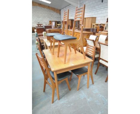 A 1960's / 70's Danish teak rectangular dining table with a set of 6 conforming ladder back dining chairs.