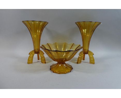 A Pair of Amber Glass Trumpet Vases on Tripod Bases and a Similar Fruit Bowl, Vases 25cm High 