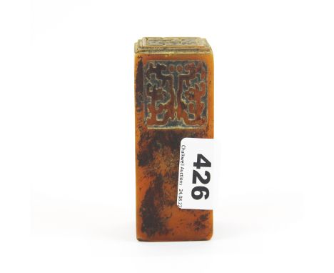 An unusual Chinese amber coloured soapstone seal, H. 10cm.