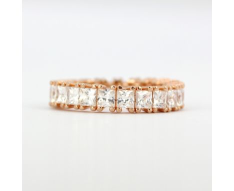 A rose gold on 925 silver full eternity ring set with princess cut cubic zirconias, (M).